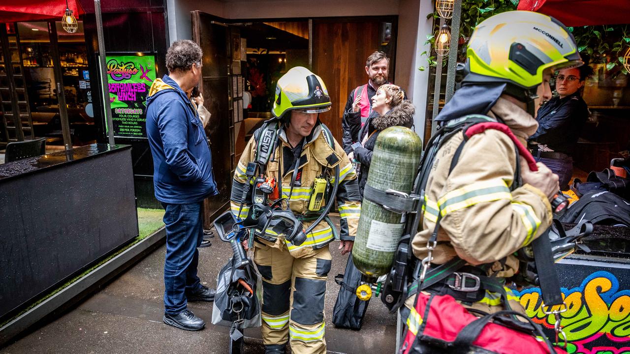 Firefighters leaving Pastuso restaurant and bar. Picture: Jake Nowakowski