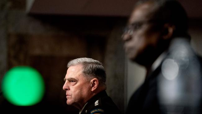 General Milley, left, and Secretary of Defence Lloyd J. Austin listen during the Senate Armed Services Committee hearing. Picture: AFP