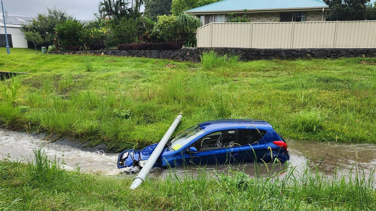 The car which was stuck in water filled ditch. Picture – Facebook.