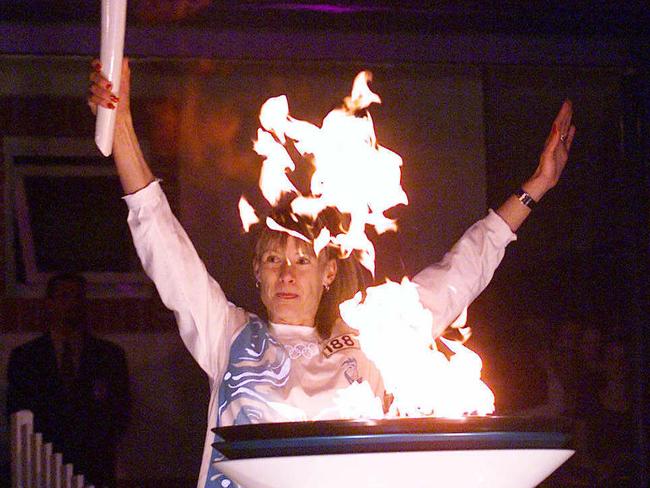 Olympic Torch Relay Day 89 through Penrith to Bowral on September 04, 2000. Heather Turland lights the cauldron in Bowral. Picture: Glen Campbell.