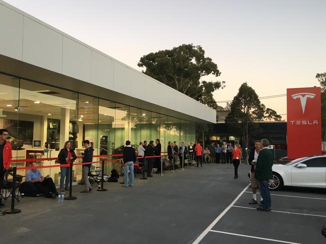 Andreas Stephens and other Tesla buyers outside the Tesla shop to place their order for a Tesla Model3