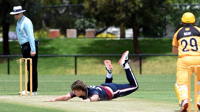 VSDCA: Yarraville’s Zachary Koch can’t stop Werribee’s Shaun Dean’s shot. Picture: Steve Tanner