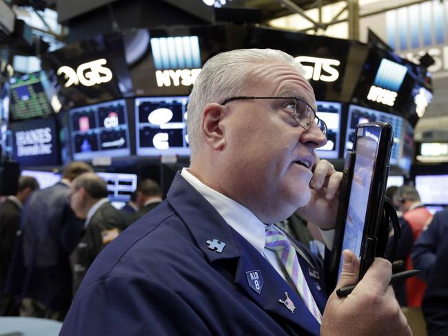 Trader Thomas Ferrigno works on the floor of the New York Stock Exchange, Tuesday, Sept. 6, 2016. U.S. stocks indexes are mostly higher in early trading as traders look over the details of several corporate deals. (AP Photo/Richard Drew)