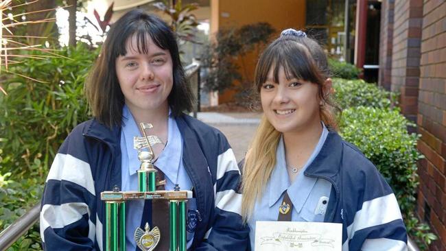 Amber Tobane and Claire Cho represented Rockhampton State High School in accepting the Music Society trophy for secondary students chamber group. Picture: Jann Houley