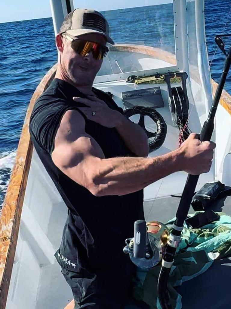 Reeling in the swordfish with his guns.