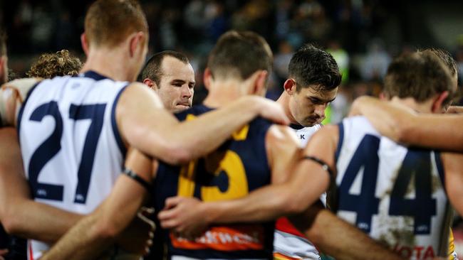 West Coast captain Shannon Hurn, left, and Taylor Walker during a minute silence for the late Phil Walsh in July, 2015. Picture: Colleen Petch