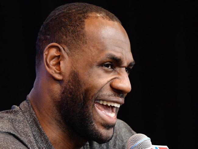 TO GO WITH AFP STORY by Jérôme RASETTI, BASKET-NBA (FILES) LeBron James of the Miami Heat speaks to the press on practice day at the Spurs Practice Facility in San Antonio, Texas, in this June 7, 2014, file photo. After four years and two NBA titles in Miami, LeBron James returns to Cleveland with the hope of propelling the Cavaliers to the top at the end of the 2014-2015 season, which begins October 28, 2014. AFP PHOTO/Robyn Beck/FILES