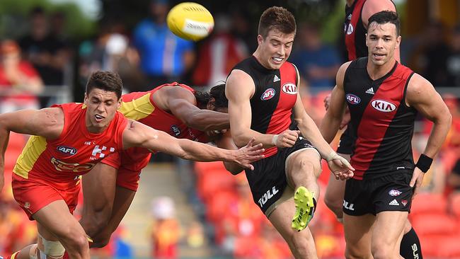 Zach Merrett gets a clearance for Essendon.