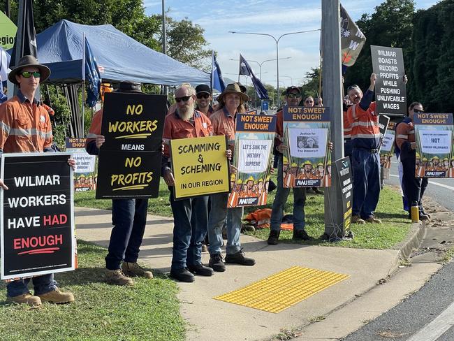 The striking workers, stationed outside the Plane Creek mill along the Bruce Highway, were unable to speak out alone for fear of repercussions from Wilmar. Photo: Fergus Gregg