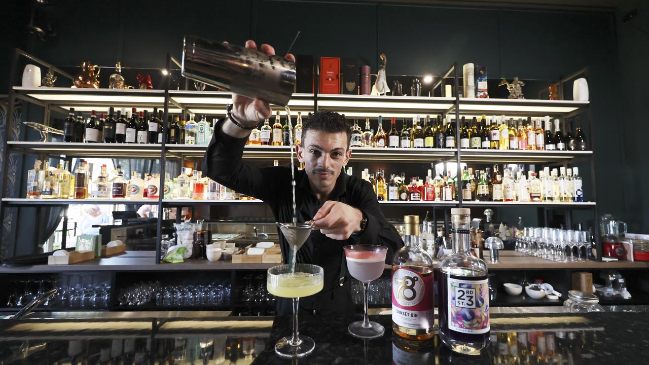 A new restaurant and adjoining bar have opened in the Drift apartment building at Palm Cove, opposite Miguel's tapas restaurant. Head bartender at Sneaky Mick's Nicolas Smith pours a Tropical Temptation cocktail at the new speakeasy bar and lounge. Picture: Brendan Radke