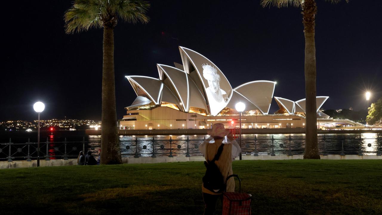 Sydney, Australia: The portrait of Queen Elizabeth projected on the sails of the Sydney Opera House on the night of her funeral on September 19. Picture: Damian Shaw