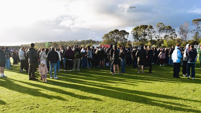 West Gippsland league grand final match 2024 — Phillip Island Bulldogs V Nar Nar Goon "The Goon" Football Club at Garfield Recreation Reserve on September 14, 2024: Crowds of spectators rush to the middle of the oval to congratulate Nar Nar Goon on their grand final win. Picture: Jack Colantuono