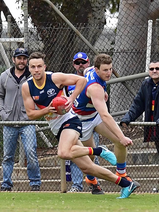 Adelaide’s Brodie Smith dashes from defence in his return to football. Picture: Tom Huntley.