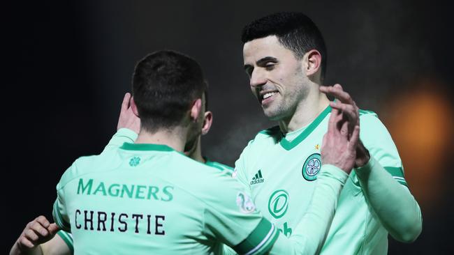 Tom Rogic (right) celebrates with Ryan Christie during happier times at Celtic. Picture: Ian MacNicol/Getty Images