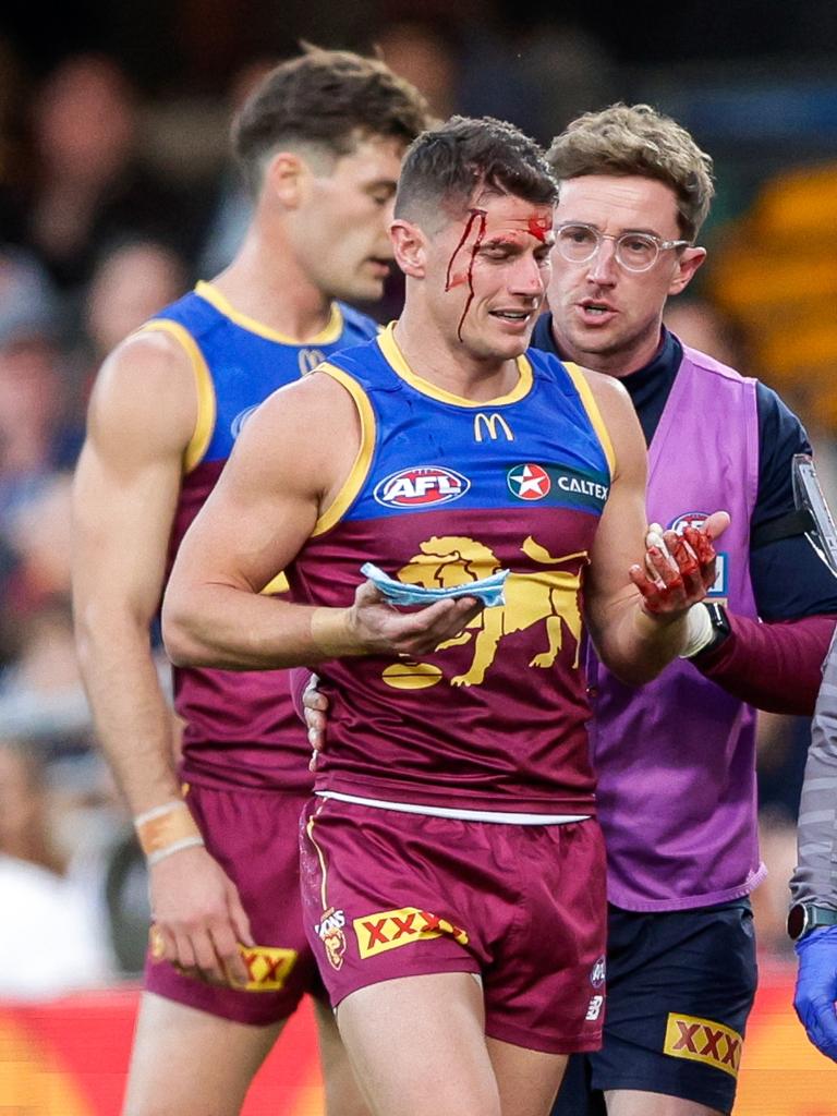 Dayne Zorko clashes heads with Patrick Dangerfield. Picture: Russell Freeman/AFL Photos