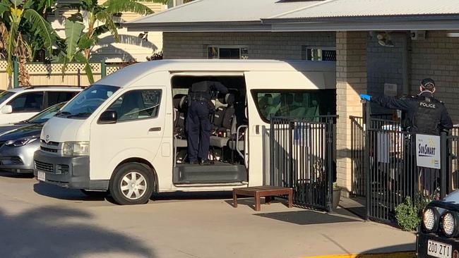 Police inspect a bus at Le Smileys Childcare Centre in Gracemere, near Rockhampton, central Queensland, after the girl was found in a critical condition on Wednesday.