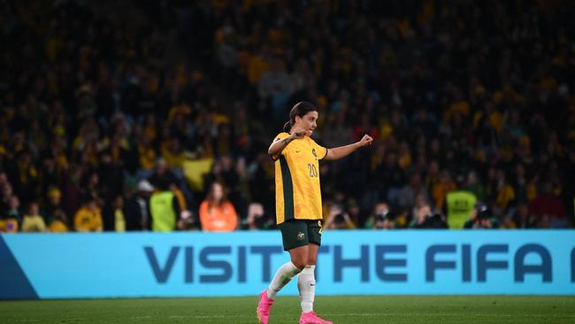 Sam Kerr soaks in the win at full time. Photo by FRANCK FIFE / AFP.