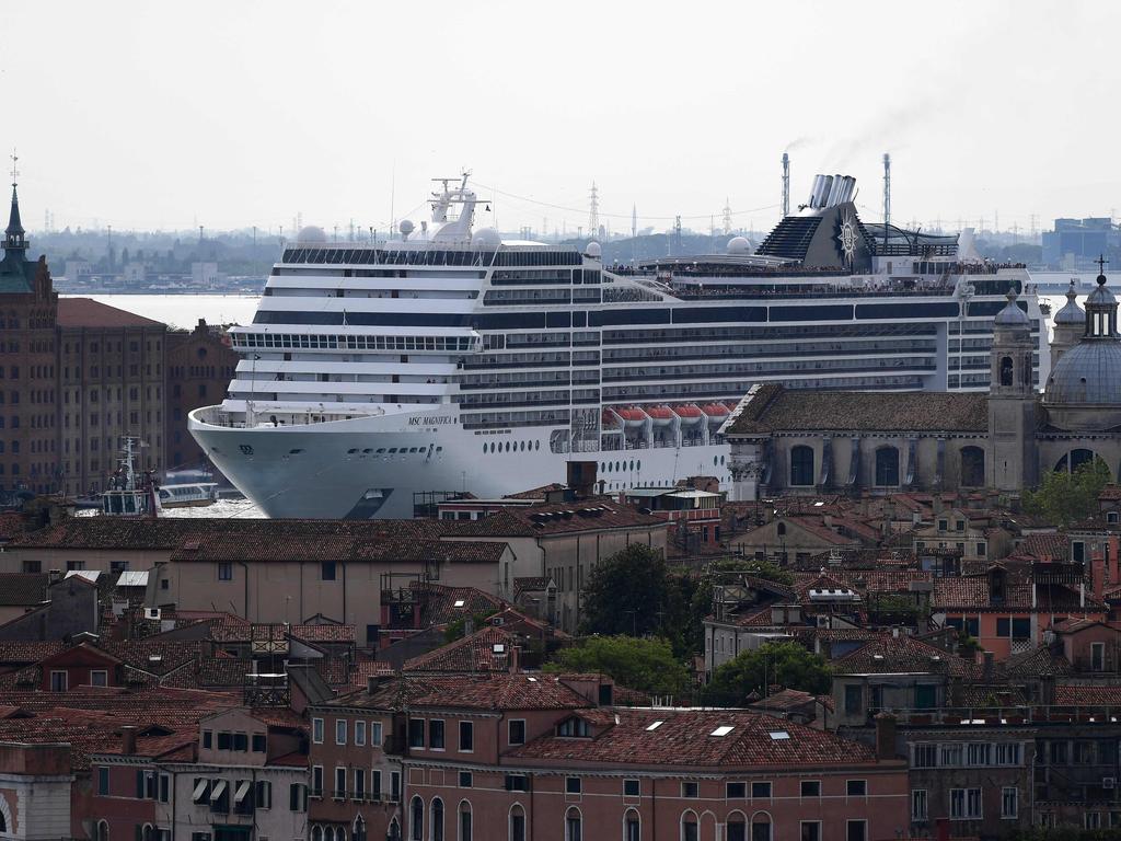 Locals want boats over 40,000 tonnes banned from the narrow waterways near San Marco Square. Picture: Miguel MEDINA / AFP.