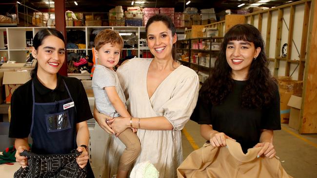 Zoe Marshall and Fox at the Salvos Store in St Peters meeting volunteers. Picture: Toby Zerna