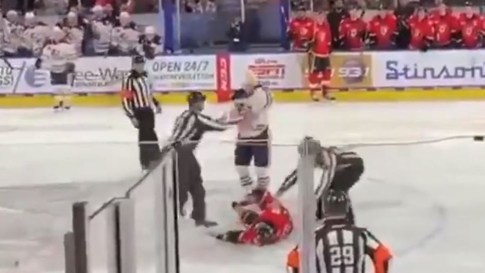 Martin Pospisil falls unconscious to the ice.