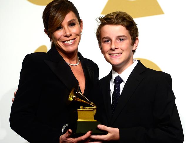 Melissa Rivers and son Cooper Endicott, with the Best Spoken Word Album award for 'Diary Of A Mad Diva' won by the late Joan Rivers, at The 57th Annual GRAMMY Awards.