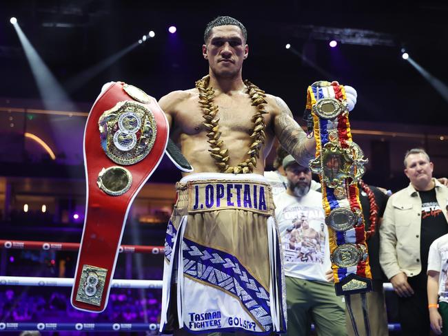 Jai Opetaia poses for a photo with his belts following victory during the IBF World Cruiserweight title fight between Jai Opetaia and Jack Massey (Photo by Richard Pelham/Getty Images)