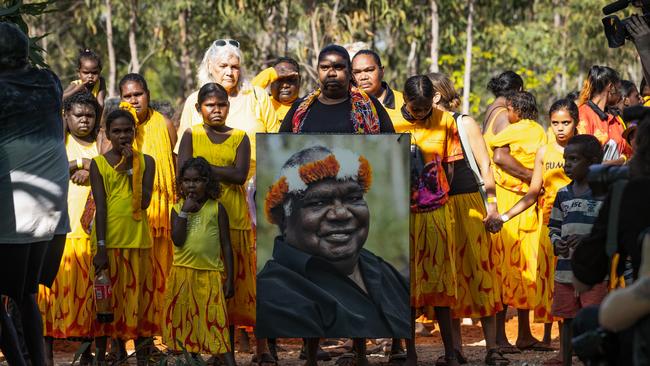 Gove residents carry an image of late elder Yunupingu on the first day of the Garma festival, the first since his death. Picture: Getty Images