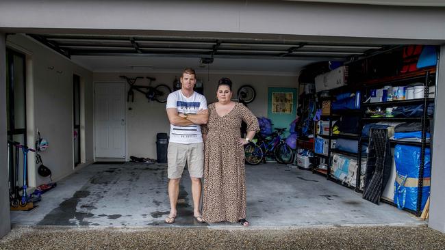 Pacific Pines couple Phil and Mel Morey have had their two cars stolen and are warning others about the danger of leaving the power on to their motorised garage door after police say the thieves used an app to remember the code of the remote door opener. Picture: Jerad Williams