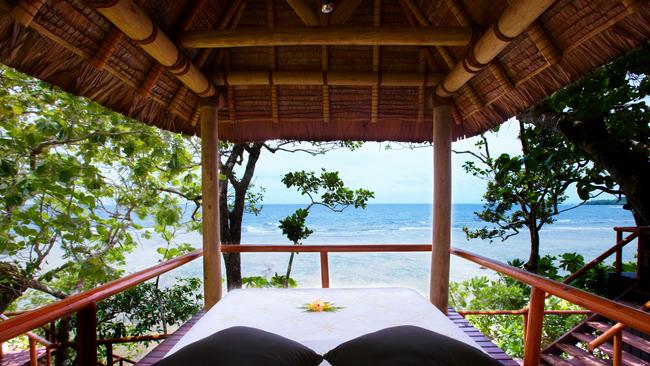 A daybed, perfect for relaxing, on Namale Resort &amp; Spa, Vanua Levu, Fiji.