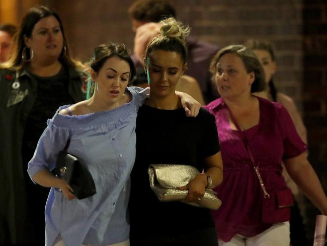 Police escort members of the public from the Manchester Arena. Picture: Getty