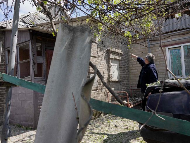 A local resident points at a damaged private house after Russian shelling in Kramatorsk, Donetsk region on May 11, 2025, amid the Russian invasion of Ukraine. Picture: AFP