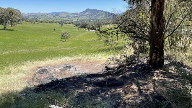 The remains of where the car crashed into a tree and burst into flames near Mansfield. Picture: Athos Sirianos