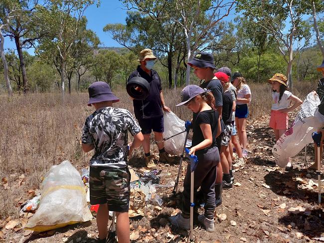 Enkindle Village School students learn how to find clues to establish the identity of illegal dumpers. Picture: Leighton Smith