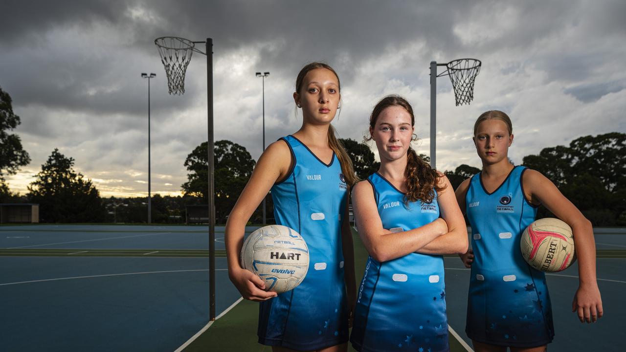 Toowoomba Netball Association U13A players (from left) Maya Cameron, Lola Marjoribanks and Elsa Bradshaw stand courtside as the association takes issue with council's lack of maintenance with lighting and other facility matters. Picture: Kevin Farmer