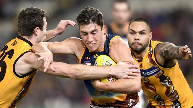 Young defender Noah Answerth tries to break a tackle against the Hawks. Picture: Getty Images