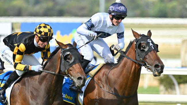 PAKENHAM, AUSTRALIA - DECEMBER 21: Beau Mertens riding Goldman defeats Zac Spain riding Grand Pierro in Race 9, the Sportsbet Pakenham Cup during Melbourne Racing at Pakenham Racing Club on December 21, 2024 in Pakenham, Australia. (Photo by Vince Caligiuri/Getty Images)