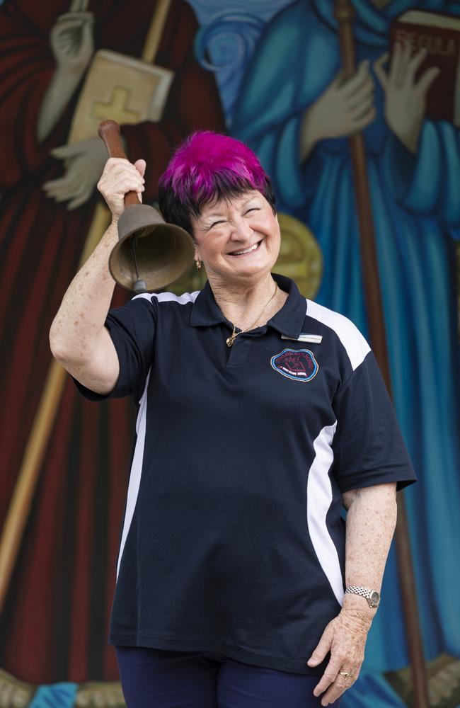 Teacher Elizabeth Kriesch with the original St Columba’s school bell rescued and refurbished by her husband Kevin. Picture: Mark Cranitch