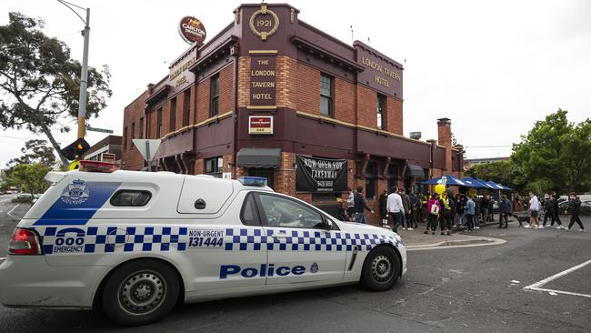 Police close down a pub in Richmond. Picture: Getty Images