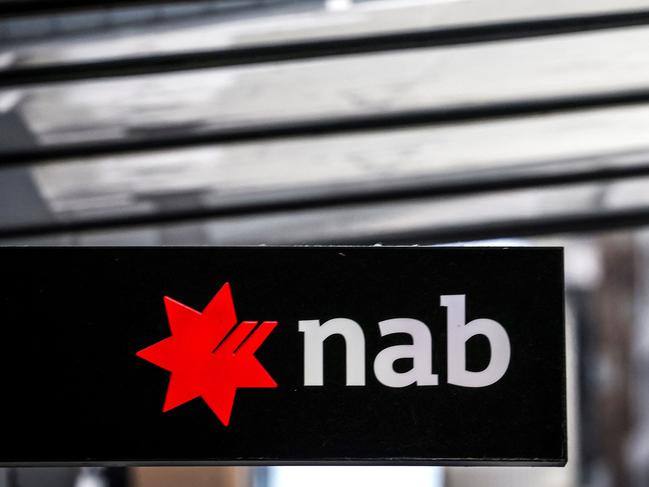 A sign displays the logo of National Australia Bank outside a branch in central Sydney on November 7, 2024. National Australia Bank released its full-year financial results for 2024 on November 7. (Photo by DAVID GRAY / AFP)