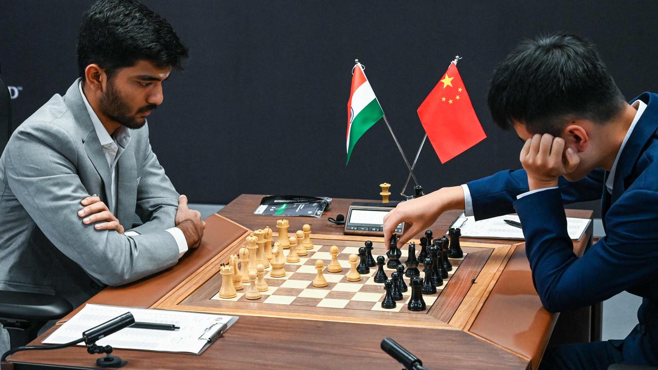 Chinese chess grandmaster Ding Liren (R) and India’s Gukesh Dommaraju (L) compete during the start of the FIDE World Chess Championship in Singapore on November 25, 2024. Picture: AFP