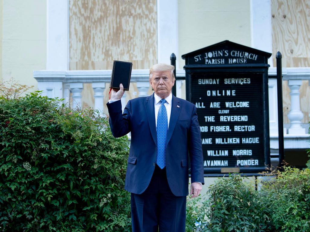 President Trump holds a bible while visiting St. John's Church across from the White House after the area was cleared of protesters. Picture: Brendan Smialowski/AFP