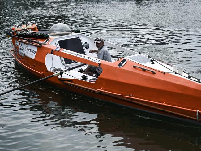 (FILES) In this file photo taken on May 28, 2021 Jean-Jacques Savin, a former paratrooper, 74, tests his rowboat at a shipyard in Lege-Cap-Ferret, southwestern France. - Jean-Jacques Savin, 75, who crossed the Atlantic Ocean in a barrel in 2019 before setting off again on January 1, 2022 to row across it, set off his distress beacons on January 21, 2022 and his team has "no further contact" since then, they say on January 22, 2022. (Photo by Philippe Lopez / AFP)