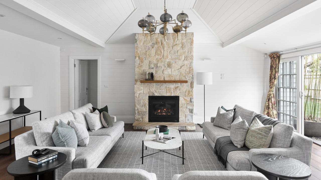 A gas log fireplace warms the living area.