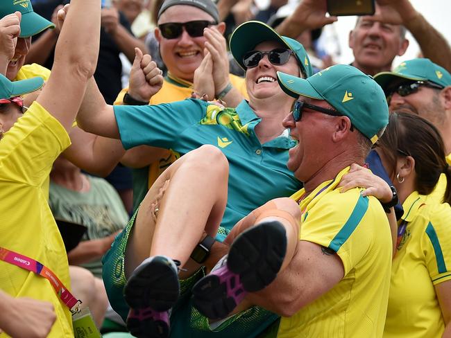 LEAMINGTON SPA, ENGLAND - AUGUST 01: Ellen Ryan of Team Australia celebrates their victory with staff members after the Women's Singles - Gold Medal Match between Guernsey and Australia on day four of the Birmingham 2022 Commonwealth Games at Victoria Park on August 01, 2022 on the Leamington Spa, England. (Photo by Nathan Stirk/2022 Getty Images)