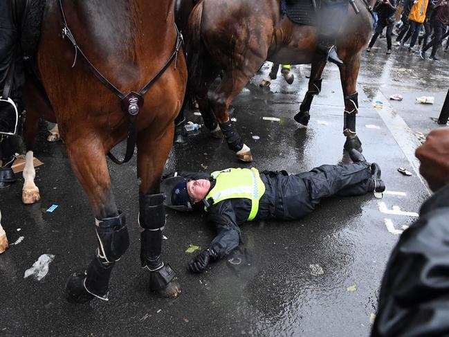 A mounted police officer was thrown their horse, during a demonstration on Whitehall, near the entrance to Downing Street in central London. Picture: AFP