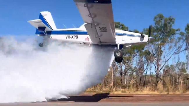 Bushfires NT aircraft conducting a water bombing activity.