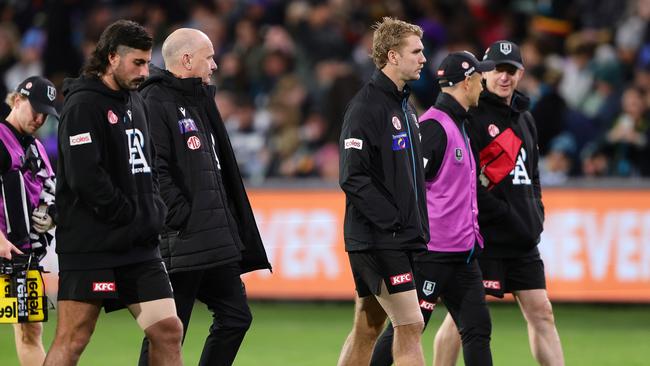 Jason Horne-Francis (third from right) also picked up a hamstring injury. (Photo by Sarah Reed/AFL Photos via Getty Images)