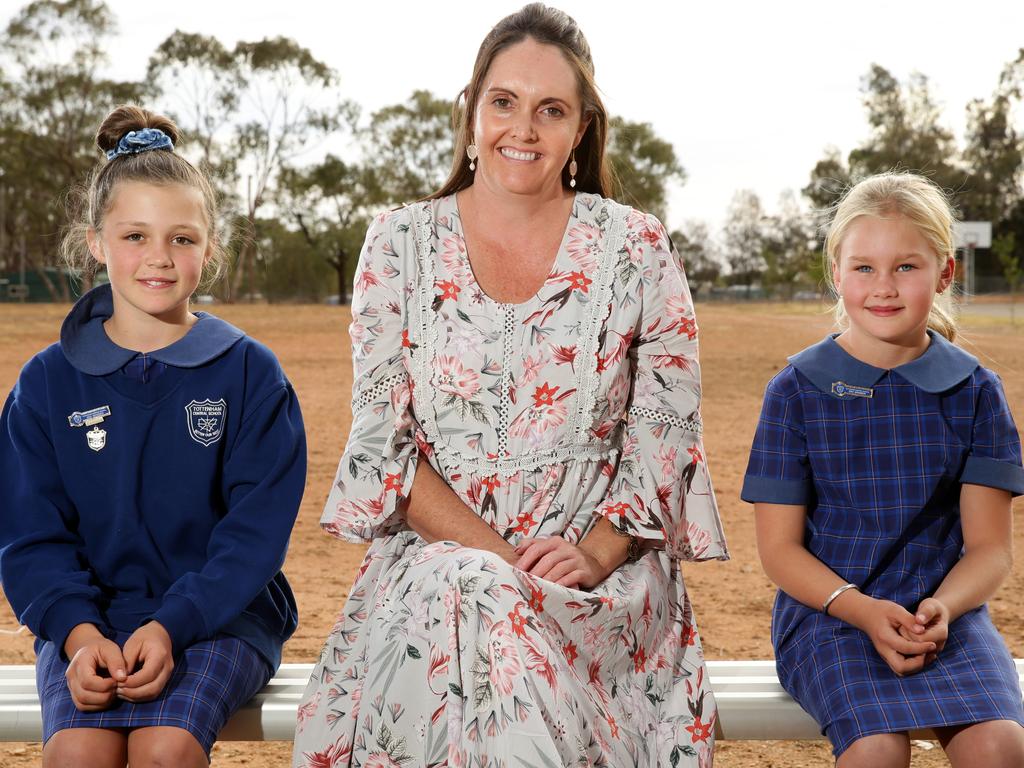 Tottenham Central School principal Amanda Thorpe with school captain Abigail Medcalf, 11, (left) and Kate Attenborough, 9, at the dry school oval. Picture: Jonathan Ng