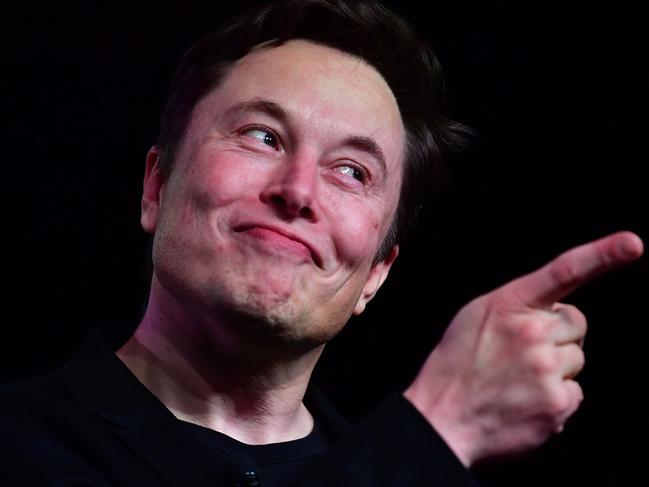 (FILES) In this file photo taken on March 14, 2019, Tesla CEO Elon Musk speaks during the unveiling of the new Tesla Model Y in Hawthorne, California. - Tesla on Monday, April 22, 2019 unveiled computer hardware for "full self-driving" capabilities as part of its strategy to bring autonomous cars to the mainstream. The chip announcement comes as Tesla races with Waymo, Uber and traditional automakers to bring autonomous vehicles to market. Chief executive Elon Musk said the new custom-designed chip, which he called the best available, was a significant milestone in self-driving. (Photo by Frederic J. BROWN / AFP)