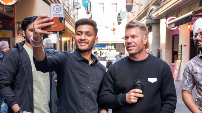 ## UNDER EMBARGO UNTIL Monday November 11, 2024 ##David Warner will front a new social media campaign for Tourism Australia targeting cricket-mad Indian travellers. David Warner with fans - Degraves Street - Melbourne, Victoria.